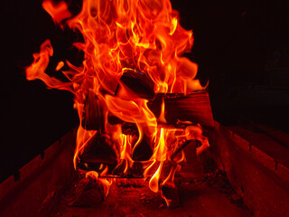 flames when burning firewood on a black background