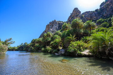 Preveli Beach - famous for the beautiful river with azure clear water and tropical palm forest...