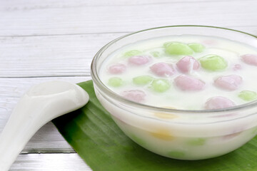 Obraz na płótnie Canvas Thai dessert with colorful flour, milk and egg, rainbow tapioca Famous Thai dessert, Bualoy