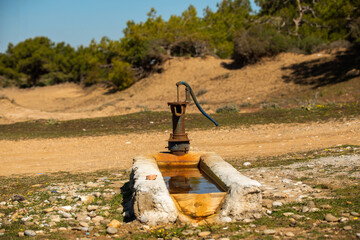 Old pump used to extract water from the field