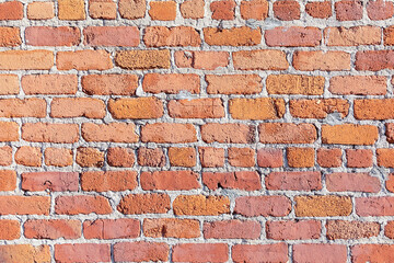brick wall of an old american building with original bricks from 19th century