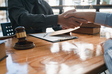 lawyer or judge shaking hands after agreeing to accept a bribe From businessman to lawsuit to win...