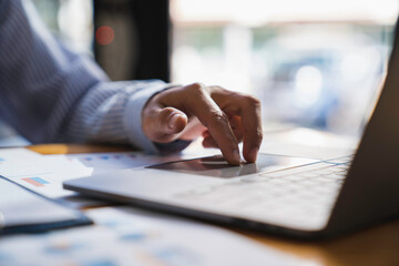 Obraz premium Accountant Or Financial Advisor Calculating Tax Using Calculator And Business Invoice On Wooden Desk