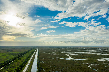 Aerial view of US Highway 41 facing west over the Everglades.  Sunny, late afternoon.