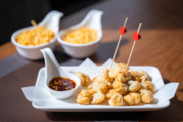 deep fried fish balls with spicy sauce