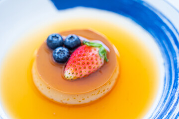 pudding caramel custard with strawberry and blueberry