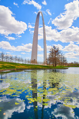 Pond with algae moss by Gateway Arch in St. Louis in early spring