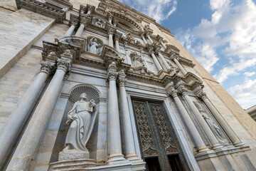 Close up of the he front doors and facade of the Basílica de San Félix in the Spanish town of Girona.