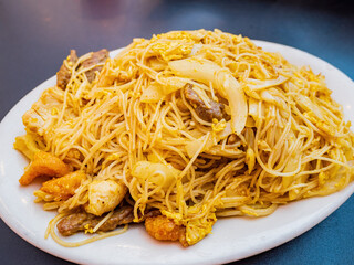 Close up shot of Singapore curry noodles