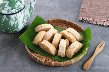 Kue Pancong, Gandos or Bandros is an Indonesian traditional snack made from a mixture of rice flour, grated coconut, and coconut milk.
