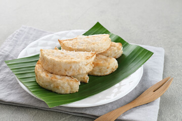 Kue Pancong, Gandos or Bandros is an Indonesian traditional snack made from a mixture of rice flour, grated coconut, and coconut milk.
