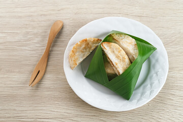 Kue Pancong, Gandos or Bandros is an Indonesian traditional snack made from a mixture of rice...