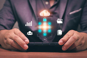 Business man using phone to upload and back up cloud computing in hand cloud technology data storage.