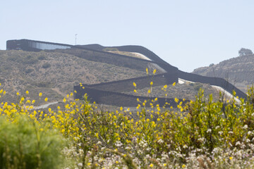 A double border wall between the U.S. and Mexico, separating San Diego and Tijuana, is seen from...