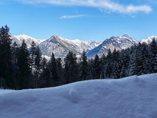 View over the mountains of Allgäu Alps near Oberstdorf on a sunny day in winter, Germany
