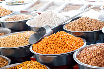 Roasted chickpeas, dried fruits and other nuts on the farmers counter at the local market or oriental bazaar