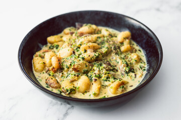 healthy plant-based food, vegan cheese and spinach potato gnocchi