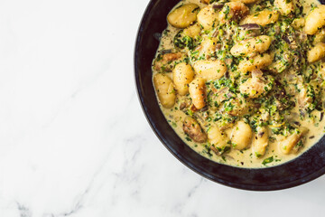 healthy plant-based food, vegan cheese and spinach potato gnocchi
