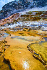Low view of hot spring terraces at Yellowstone in winter