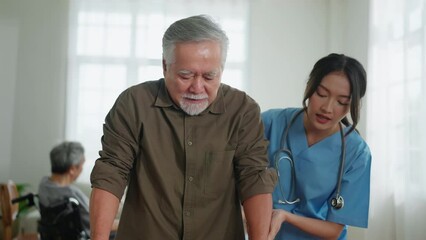 young asian female nurse care giver helping asian senior old man with mobility walker in living area of nursing home senior daycare center,Nurse take care elderly patient with cheerful concentrate