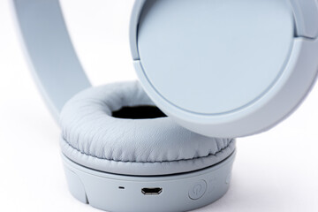 Close-up gray wireless headset on white background.	