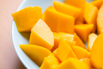 Diced fresh mango fruit on plate