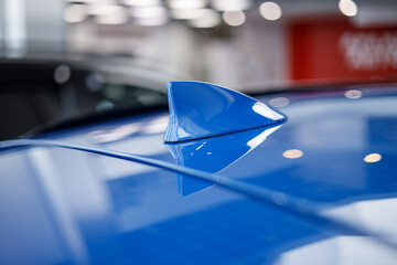 Close-up GPS antenna shark fin shape on a roof of car for radio navigation system. Antenna shark...