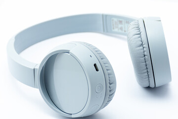Close-up gray wireless headset on white background.	
