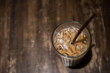 ice espresso coffee on wooden table by top view in cafes