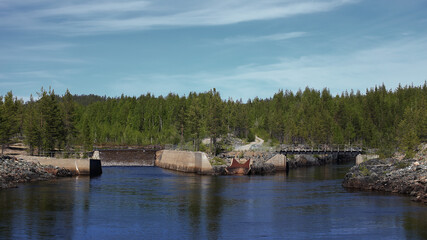 Obraz premium Steel ramp at a northern Swedish river, once used for stream regulation