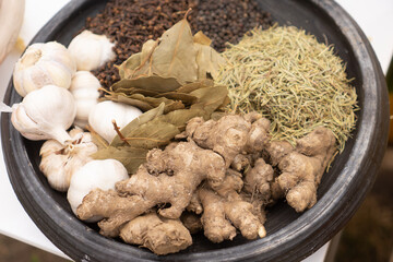 Fototapeta premium Traditional organic spices in an earthenware bowl