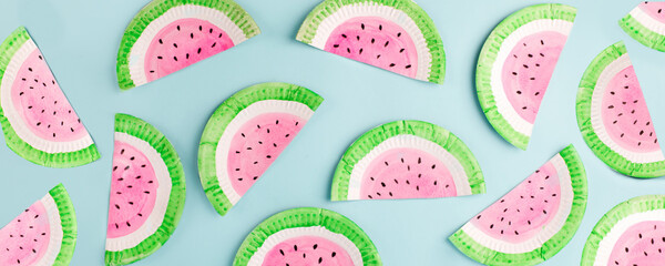Fruit made of paper - watermelon. Blue background. Tropics creative concept, kindergarten, daycare...