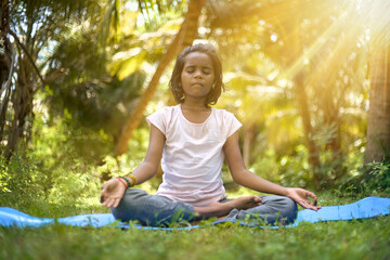  A young girl or people pose balance body  and meditation for workout nature - Asian girl - International yoga day June 21 - Yoga for Humanity