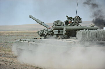 Almaty, Kazakhstan - 08.22.2012 : A tank drives through a field during military exercises.