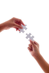 Close up hand two people holding jigsaws connecting puzzle elements on white isolated background