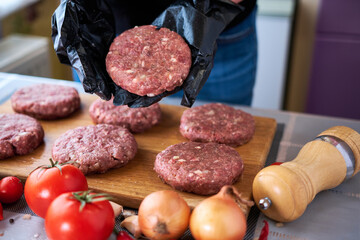 Making Billets for burgers from fresh minced meat on domestic kitchen