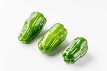 Green peppers on white background