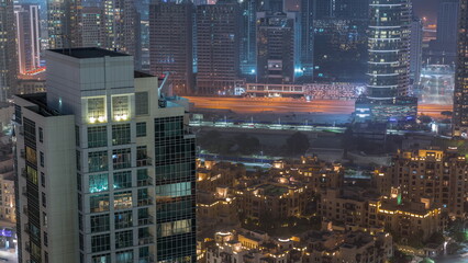 Fototapeta na wymiar Aerial view of a big futuristic city night timelapse. Business bay and Downtown
