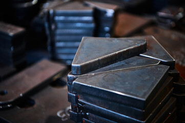 Piles of different workpieces made of metal material sheet
