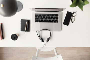 Workplace, laptop computer with headphones headset. Business, technology, working from home,...