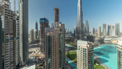 Foto op Plexiglas Panorama showing Dubai Downtown cityscape with tallest skyscrapers around aerial timelapse. © neiezhmakov
