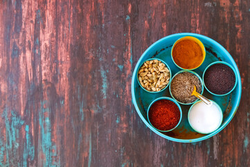 Spice box Indian masala dabba,indian spice box on wooden,Cardamom, turmeric, chilli powder,...