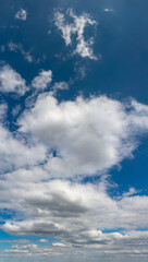 Fantastic clouds against blue sky, panorama