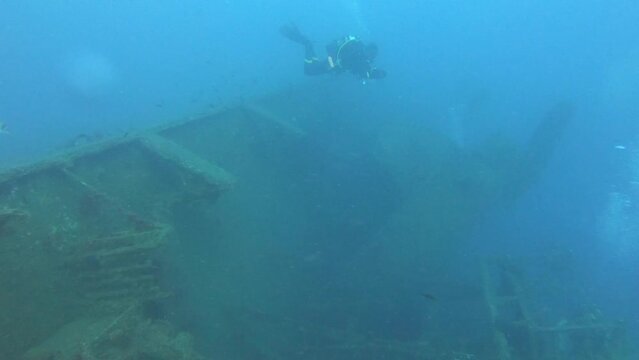 Scuba Divers Swims On The Shipwreck Swedish Ferry Zenobia. Wreck Diving in Larnaca, Cyprus.