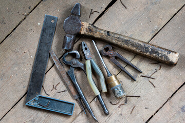 old tools on wooden boards with slits