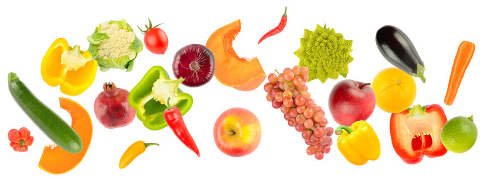 Falling colorful vegetables and fruits isolated on white