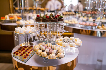 Sweets, macaroons, cake. Sweet candy bar for a holiday.