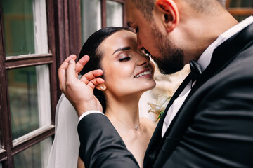 Bride and groom on their wedding day. Wedding couple, woman and man are hugging.