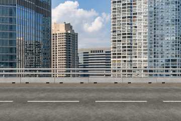 Fototapeta premium Empty urban asphalt road exterior with city buildings background. New modern highway concrete construction. Concept of way to success. Transportation logistic industry fast delivery. Chicago. USA.