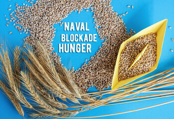 grain wheat and spikelets on a blue background. Ukrainian grain and problems of sea blockade of ports.	
 - obrazy, fototapety, plakaty